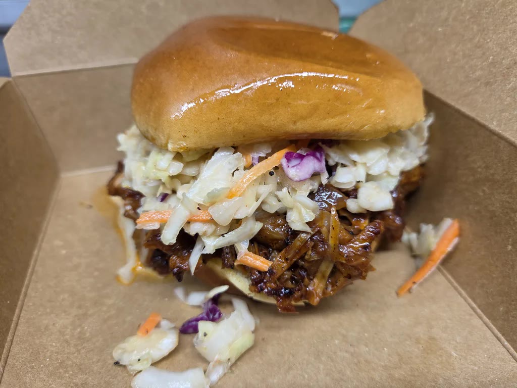 The OG Jack — BBQ pulled jackfruit with fresh coleslaw on a brioche bun